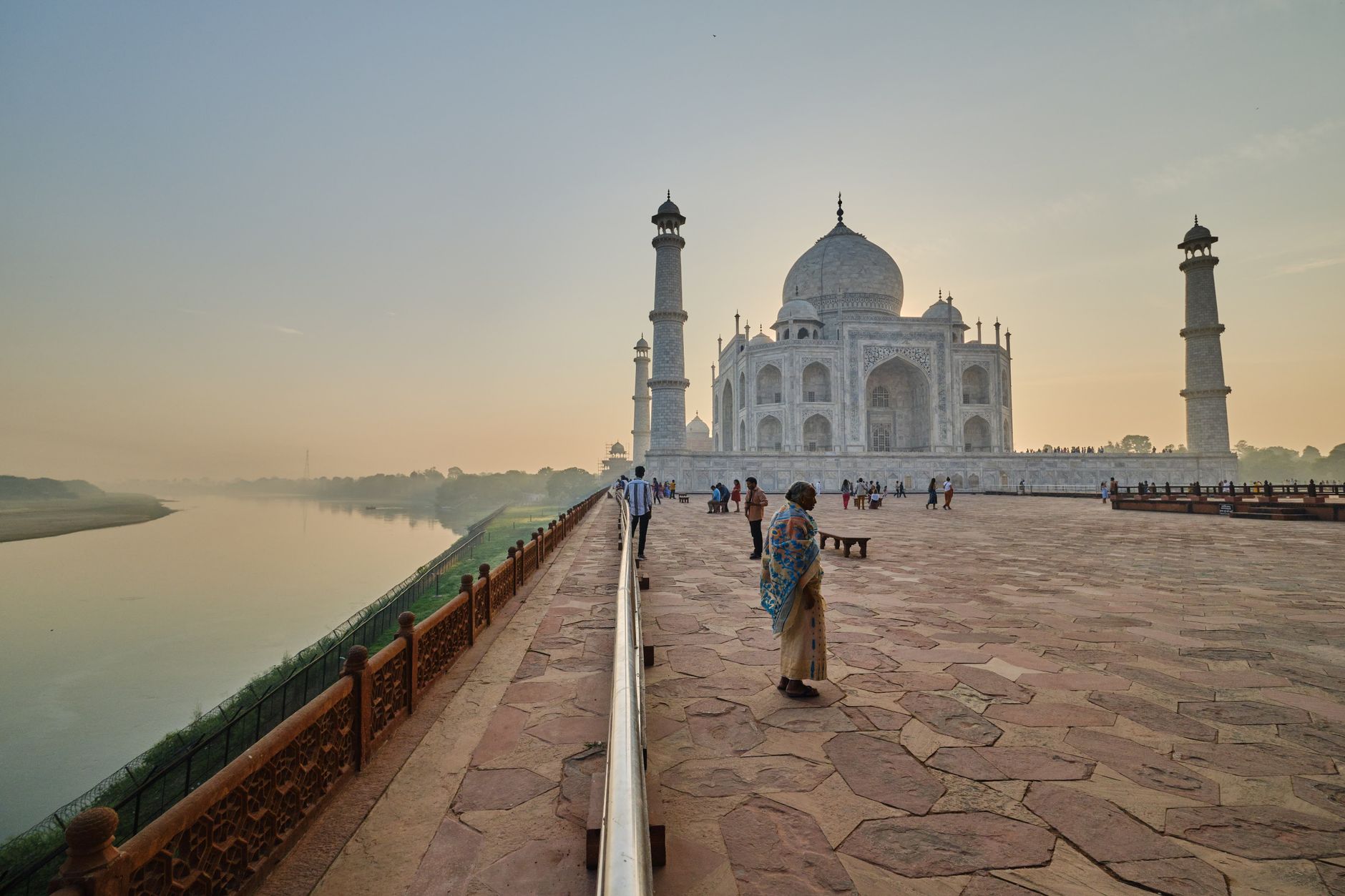 people on plaza near taj mahal in india