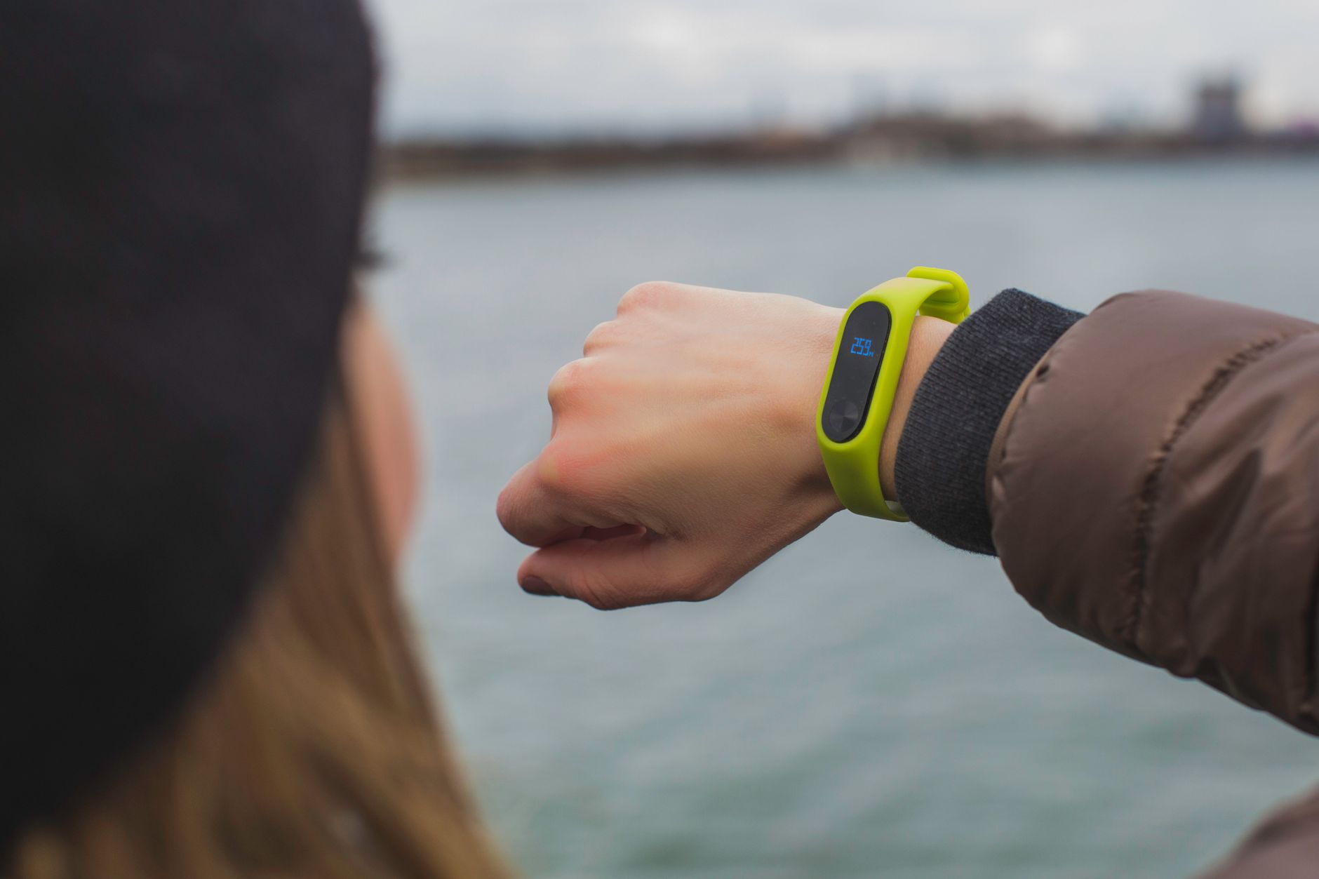 woman looking her watch